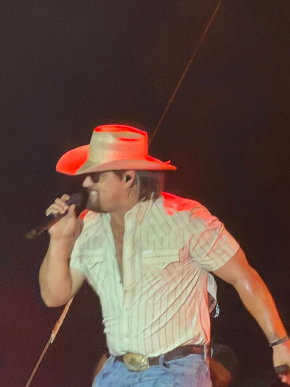 Gavin Adcock leaning toward the crowd while singing